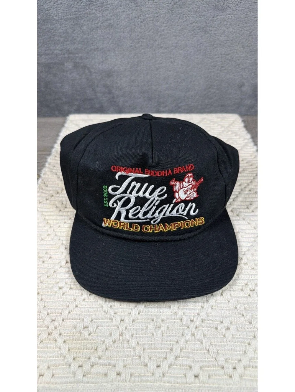 True Religion Buddha World Champions Snapback Hat Black Guitar Logo